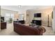 Cozy upstairs living room with a large television, comfortable seating, and custom lamps at 4122 Banfield Pl, Charlotte, NC 28226