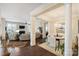 Open-concept living space with hardwood floors, fireplace, and elegant dining area at 4122 Banfield Pl, Charlotte, NC 28226