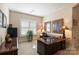 Office space with custom wood desk, neutral tones, and plantation shutters at 4122 Banfield Pl, Charlotte, NC 28226