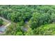 Aerial view showcases a home tucked away in a lush, expansive forest, offering privacy at 4705 Campground View Rd, Catawba, NC 28609