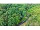 Aerial view of property surrounded by a dense, mature forest, offering a serene, secluded setting at 4705 Campground View Rd, Catawba, NC 28609
