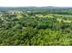 Expansive aerial shot captures rolling hills of dense green trees, providing scenic views and natural beauty at 4705 Campground View Rd, Catawba, NC 28609