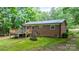 Back exterior featuring a wood deck, metal roof, and swing at 4705 Campground View Rd, Catawba, NC 28609