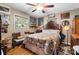 Cozy bedroom with hardwood floors, ceiling fan and a decorative quilt on the bed at 4705 Campground View Rd, Catawba, NC 28609