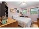 Comfortable bedroom with a ceiling fan, double windows, and a calming lilac color scheme at 4705 Campground View Rd, Catawba, NC 28609