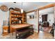 Inviting dining area with a wooden table, bench seating, and ample storage space for dinnerware at 4705 Campground View Rd, Catawba, NC 28609