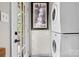 Efficient laundry area featuring a stacked washer and dryer, with easy access to the backyard at 4705 Campground View Rd, Catawba, NC 28609