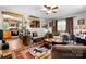 Cozy living room featuring a ceiling fan, comfortable seating, and an adjacent open kitchen at 4705 Campground View Rd, Catawba, NC 28609