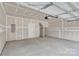 Spacious, unfinished two-car garage with a white door at 5201 Shasta St # 5201, Gastonia, NC 28052