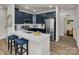 Stylish kitchen featuring navy cabinets, quartz countertops, stainless steel appliances, and modern fixtures at 5201 Shasta St # 5201, Gastonia, NC 28052