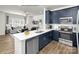 Contemporary kitchen with blue cabinetry, a quartz countertop island, and stainless steel appliances at 5201 Shasta St # 5201, Gastonia, NC 28052