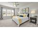 Beautifully decorated bedroom with large windows, decorative lamps, ceiling fan, and colorful pillows at 5201 Shasta St # 5201, Gastonia, NC 28052