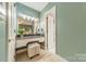 Bathroom vanity area with granite countertop, mirror and seating at 532 Courtney Ln, Matthews, NC 28105