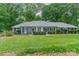Charming single story home with well-manicured lawn, symmetrical landscaping, and a welcoming front entrance at 532 Courtney Ln, Matthews, NC 28105