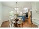 Eat-in kitchen with island, pendant lighting, stainless appliances and light-filled windows at 532 Courtney Ln, Matthews, NC 28105