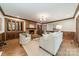 Living room with hardwood floors, fireplace, traditional mouldings, and neutral decor at 532 Courtney Ln, Matthews, NC 28105