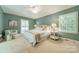 Bright main bedroom features neutral decor and light carpet at 532 Courtney Ln, Matthews, NC 28105