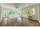 Bright sunroom with multiple windows providing natural light and views of the outdoor landscape at 532 Courtney Ln, Matthews, NC 28105