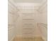 Walk-in closet with installed white wire shelving at 532 Courtney Ln, Matthews, NC 28105