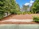 Spacious backyard showcasing mature trees and a serene landscape at 581 Harrison Nw Dr, Concord, NC 28027