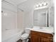 Well-lit bathroom featuring tile flooring, bath tub, and vanity with mirror at 581 Harrison Nw Dr, Concord, NC 28027