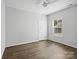Neutral bedroom featuring modern ceiling fan and hardwood floors, perfect for relaxation at 581 Harrison Nw Dr, Concord, NC 28027