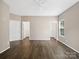 Primary bedroom with hardwood floors and two doors to closets or ensuite bath at 581 Harrison Nw Dr, Concord, NC 28027