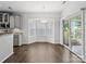 Dining area features hardwood floors, a bay window, and a sliding glass door to the outside at 581 Harrison Nw Dr, Concord, NC 28027