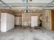Spacious garage with built-in storage cabinets and concrete flooring at 581 Harrison Nw Dr, Concord, NC 28027