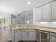 Kitchen peninsula bar with granite countertops and stainless steel appliances at 581 Harrison Nw Dr, Concord, NC 28027