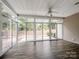 Bright sunroom with large sliding glass doors and hardwood floors at 581 Harrison Nw Dr, Concord, NC 28027