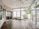 Cozy sunroom featuring a ceiling fan and expansive glass doors overlooking the yard at 581 Harrison Nw Dr, Concord, NC 28027