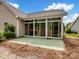This home features a sunroom addition with sliding glass doors to the backyard patio at 581 Harrison Nw Dr, Concord, NC 28027