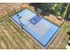 Aerial view of a meticulously maintained outdoor basketball court with professional grade surface and lighting at 6108 Phyliss Ln, Mint Hill, NC 28227