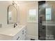 Modern bathroom featuring a black and white vanity and shower stall at 6108 Phyliss Ln, Mint Hill, NC 28227