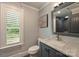 Stylish bathroom with marble countertops and views of the outdoors at 6108 Phyliss Ln, Mint Hill, NC 28227