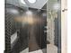 Contemporary bathroom with a sleek glass shower and unique tile work at 6108 Phyliss Ln, Mint Hill, NC 28227