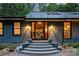 Inviting front entrance featuring a decorative stairway, glass front door and exterior lighting at 6108 Phyliss Ln, Mint Hill, NC 28227