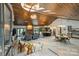 Open concept living room with vaulted ceilings, wood beams, and modern lighting fixtures at 6108 Phyliss Ln, Mint Hill, NC 28227