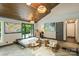 Cozy living room features unique lighting fixtures, neutral furniture, and access to the outdoors at 6108 Phyliss Ln, Mint Hill, NC 28227