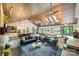 Open concept living space includes a full kitchen, multiple seating areas, and backyard views at 6108 Phyliss Ln, Mint Hill, NC 28227