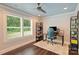 Serene home office with large windows, desk, and ample storage at 6108 Phyliss Ln, Mint Hill, NC 28227