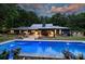 Back of house showcasing luxurious pool and a spacious outdoor patio area, perfect for entertaining at 6108 Phyliss Ln, Mint Hill, NC 28227