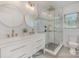 Bathroom featuring double vanity, walk-in shower with glass door, and modern fixtures at 6301 Vernedale Rd, Charlotte, NC 28212