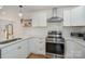 Beautiful kitchen with stainless steel appliances and ample counter space at 6301 Vernedale Rd, Charlotte, NC 28212