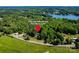 Aerial view of 6766 Little Mountain Rd, Sherrills Ford, NC, showcasing the property's location near the lake and surrounding trees at 6766 Little Mountain Rd, Sherrills Ford, NC 28673