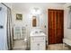 Practical bathroom with vanity, mirror, and shower-tub combination at 6766 Little Mountain Rd, Sherrills Ford, NC 28673