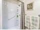 Bright bathroom featuring a shower with shelving and a shower curtain at 6766 Little Mountain Rd, Sherrills Ford, NC 28673