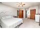 Large bedroom with ceiling fan, plenty of closet space, and ensuite bathroom at 6766 Little Mountain Rd, Sherrills Ford, NC 28673