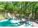 Well-appointed outdoor deck featuring comfortable seating and a tranquil setting, perfect for enjoying outdoor living at 6766 Little Mountain Rd, Sherrills Ford, NC 28673